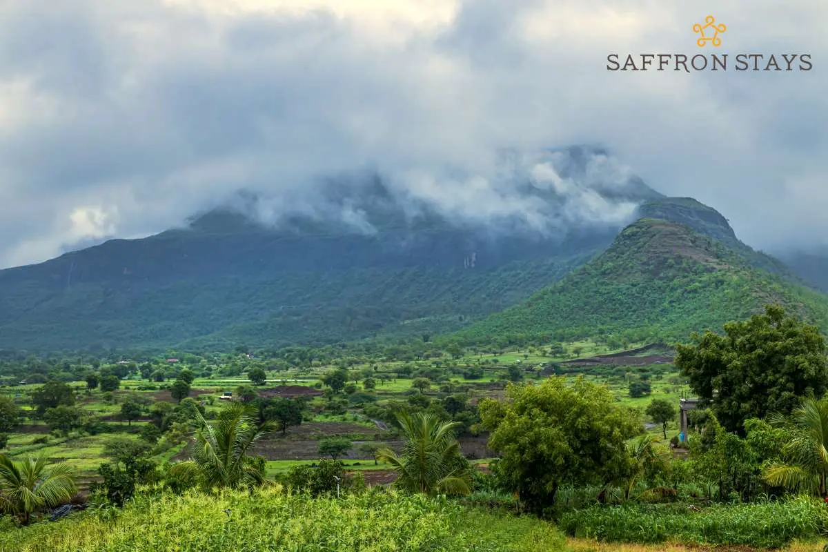 Lush mountains, expansive green landscapes, open skies and a placid lake awaits you at SaffronStays Serenity.