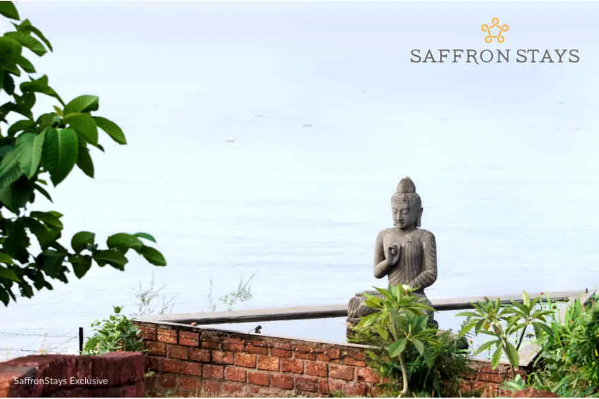 This intricately carved Buddha statue made of volcanic rock sits at the centre of the pond. This and several other rustic artefacts have been brought in from Bali. 
