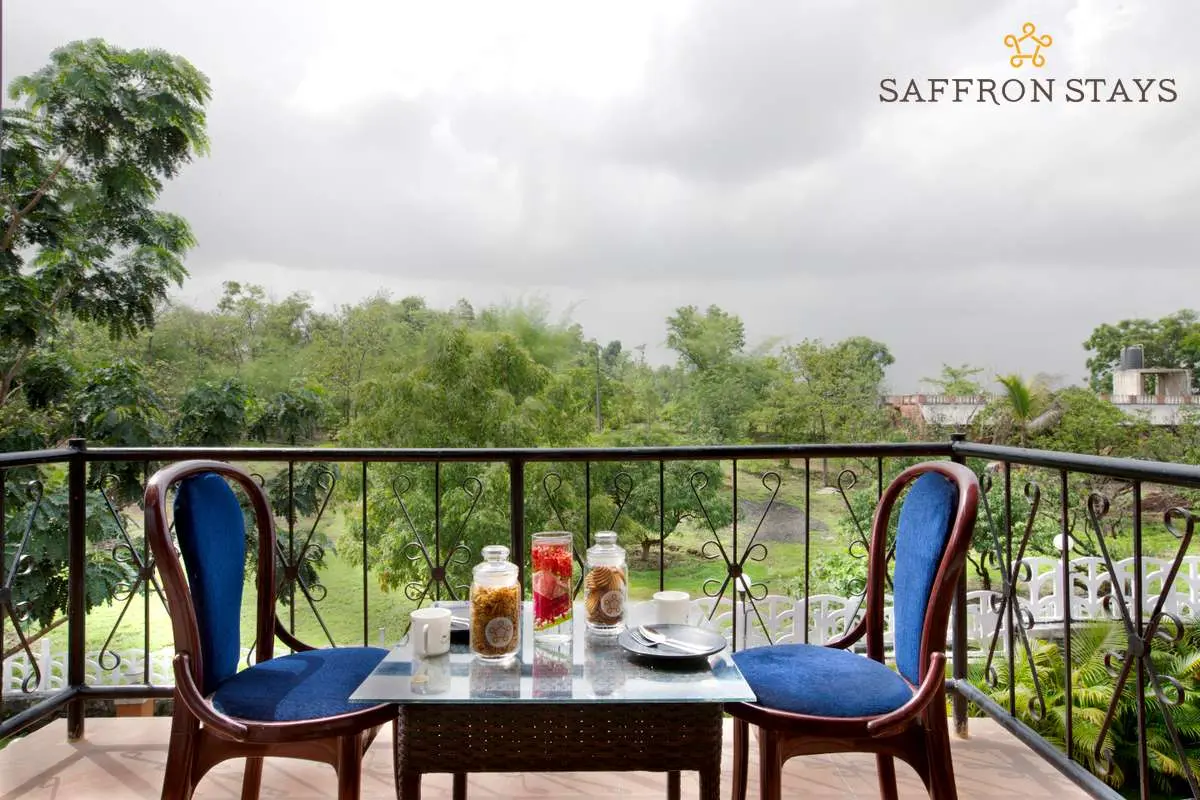 Enjoy a steaming cup of hot coffee and snacks from the balcony of your room overlooking the verdant nature. 