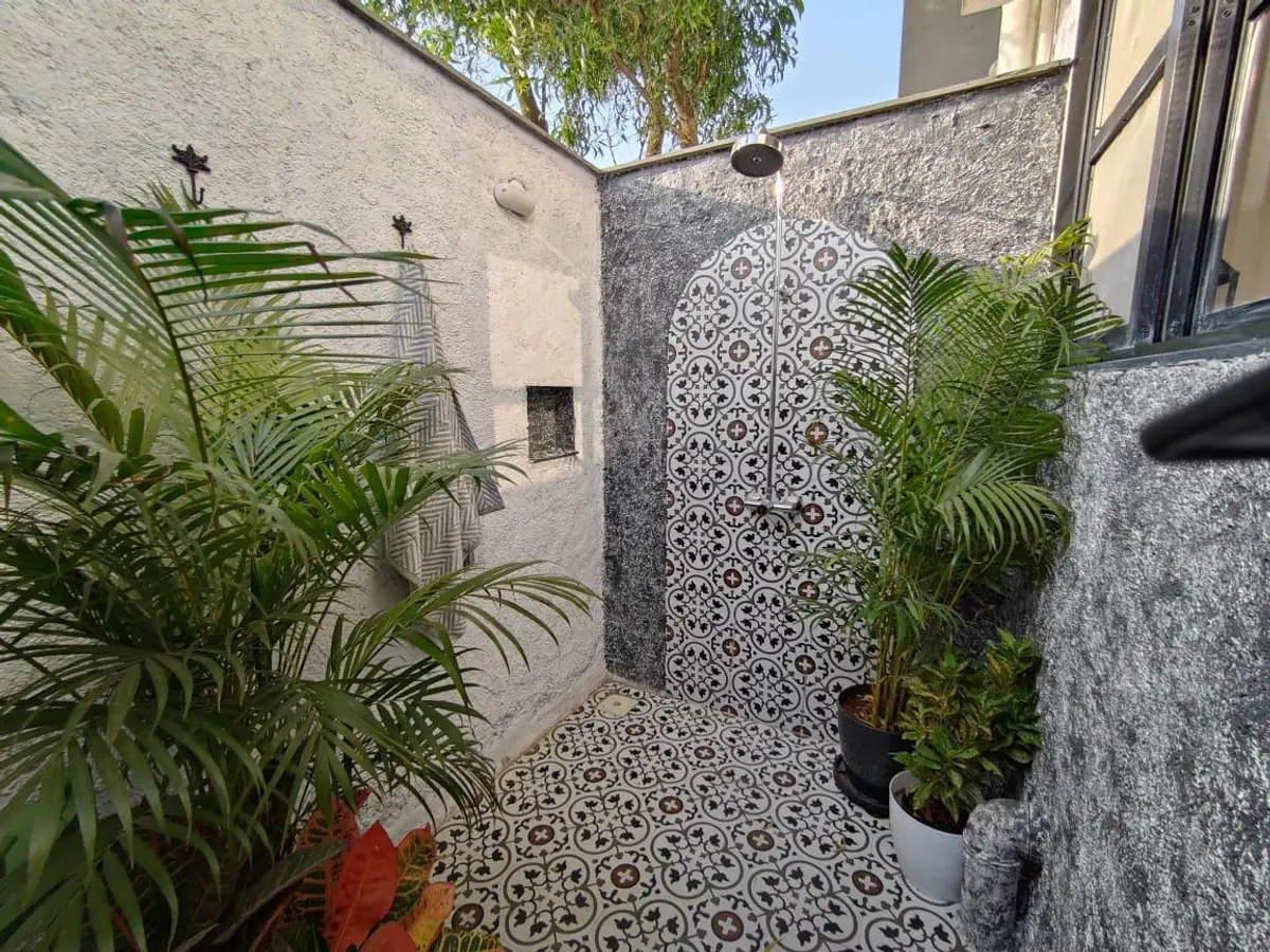 Outdoor Shower under the green canopy