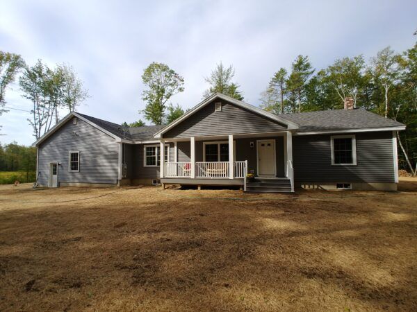 new modular ranch home project with attached garage and porch completed by Brookewood Builders, Manchester, ME 04351