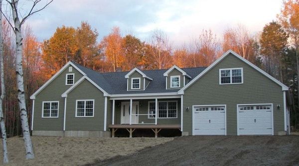 new custom modular ranch home with attached garage porch dormers completed by Brookewood Builders, Manchester, ME 04351