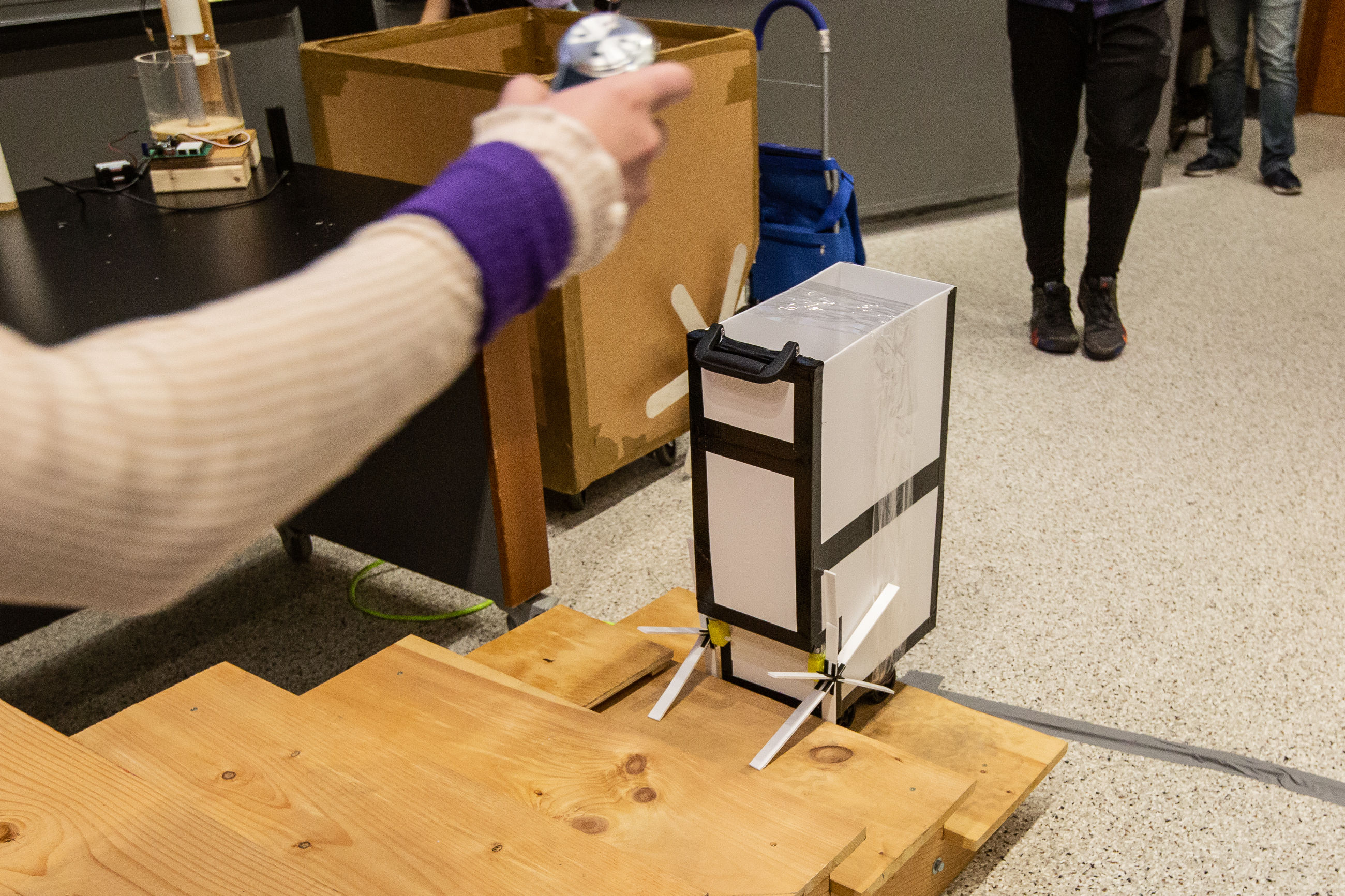 Cart with the motorized spokes that can assist people in pulling their carts up stairs