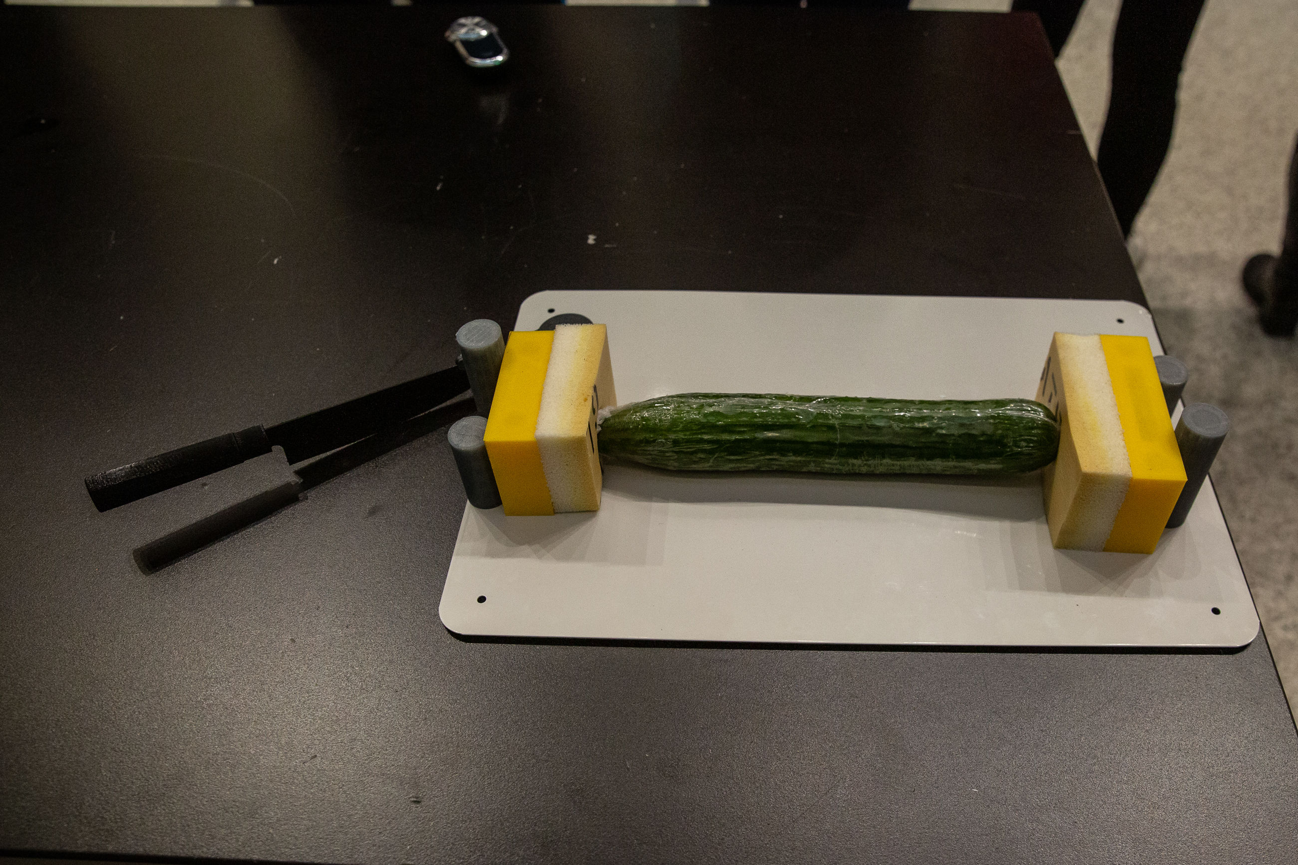 A modular cutting board designed to make cooking easier for those with impaired motor function by including magnetic attachments and a pivoting knife.