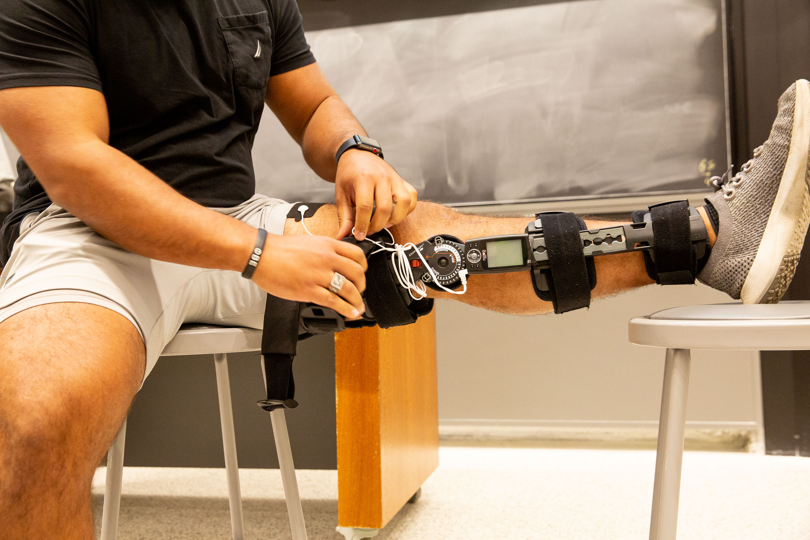 A functional knee brace with built in stimulating electrodes to prevent muscle atrophy in recovering patients.