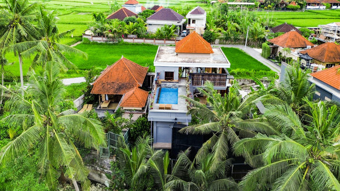 Aerial view over the Sky Residence villa and rice fields