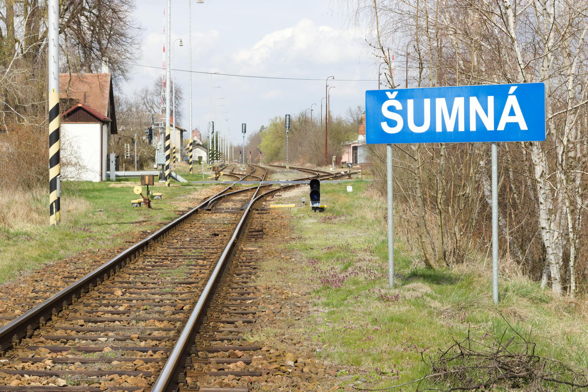 Quiet rural landscape with quaint villages seen from luxury train window during sunset