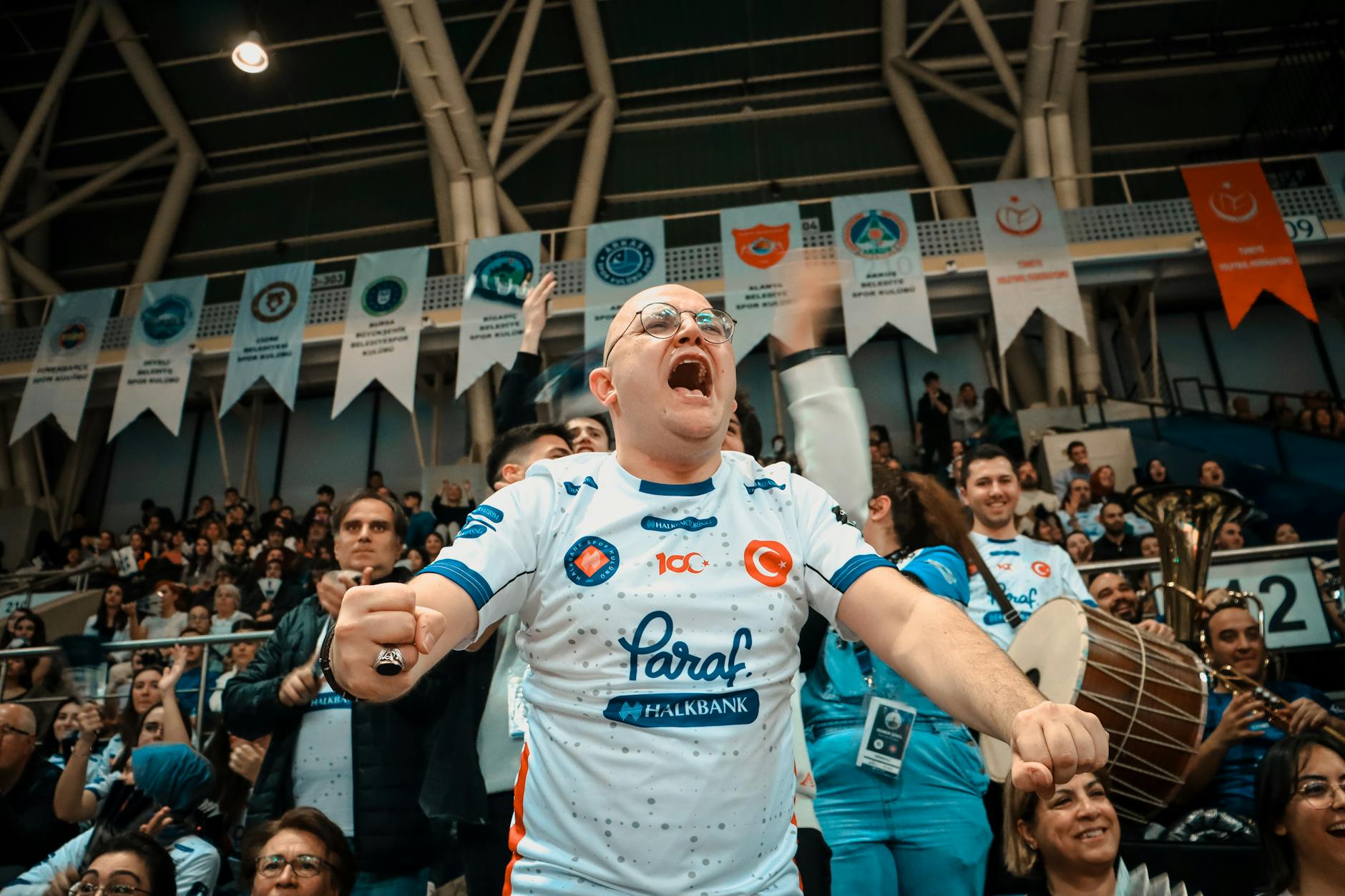 Small-town sports festival with locals playing traditional games and tourists joining the fun