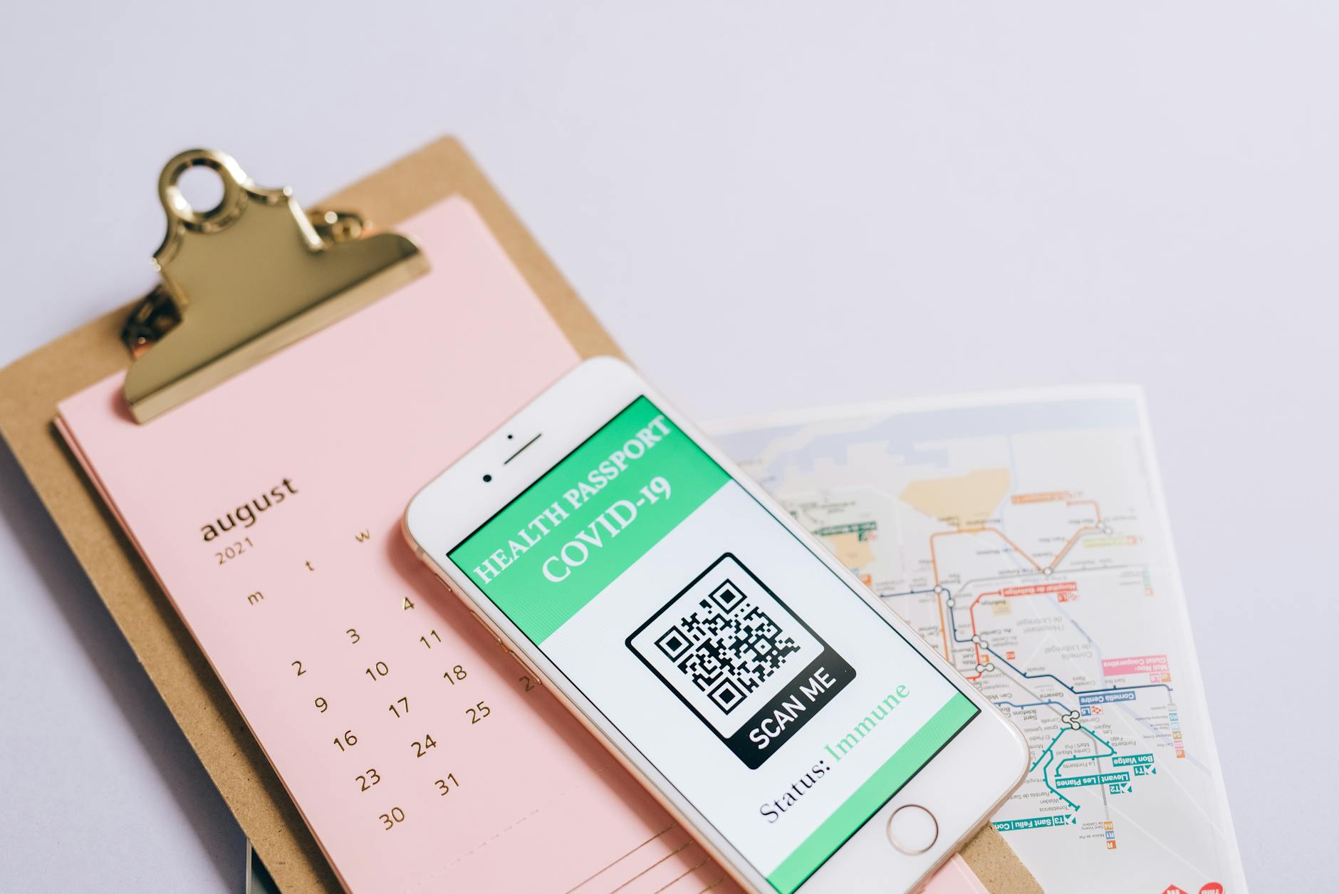 Stock trading concepts with passport, credit cards, cash, and smartphone app image.