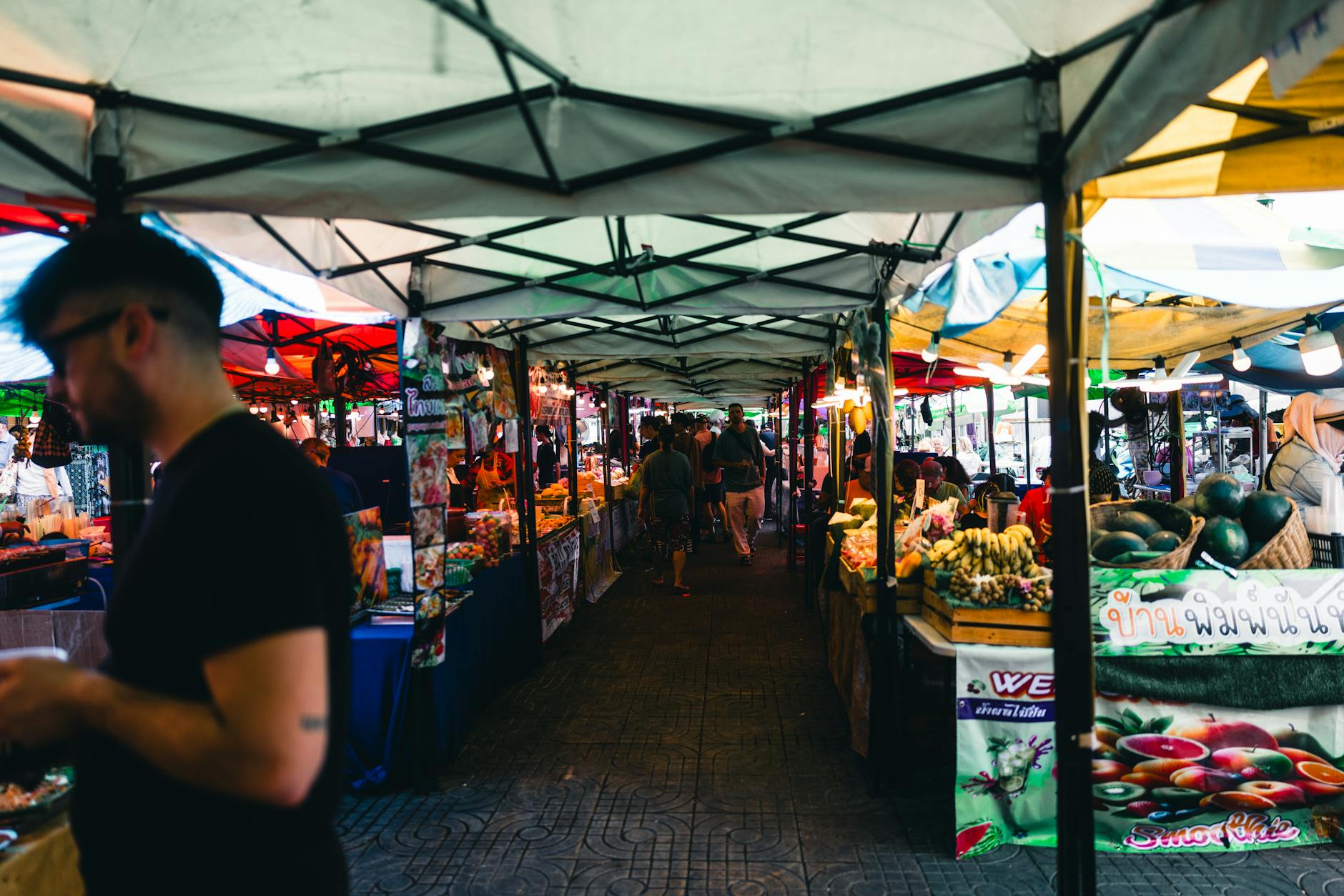 Bustling Bangkok street with traffic and iconic architecture. Urban life in Thailand's capital.