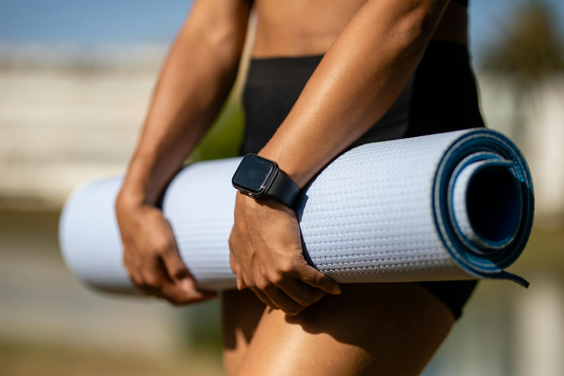 Traveler using wearable health device and smartphone to track wellness activities in a luxury retreat