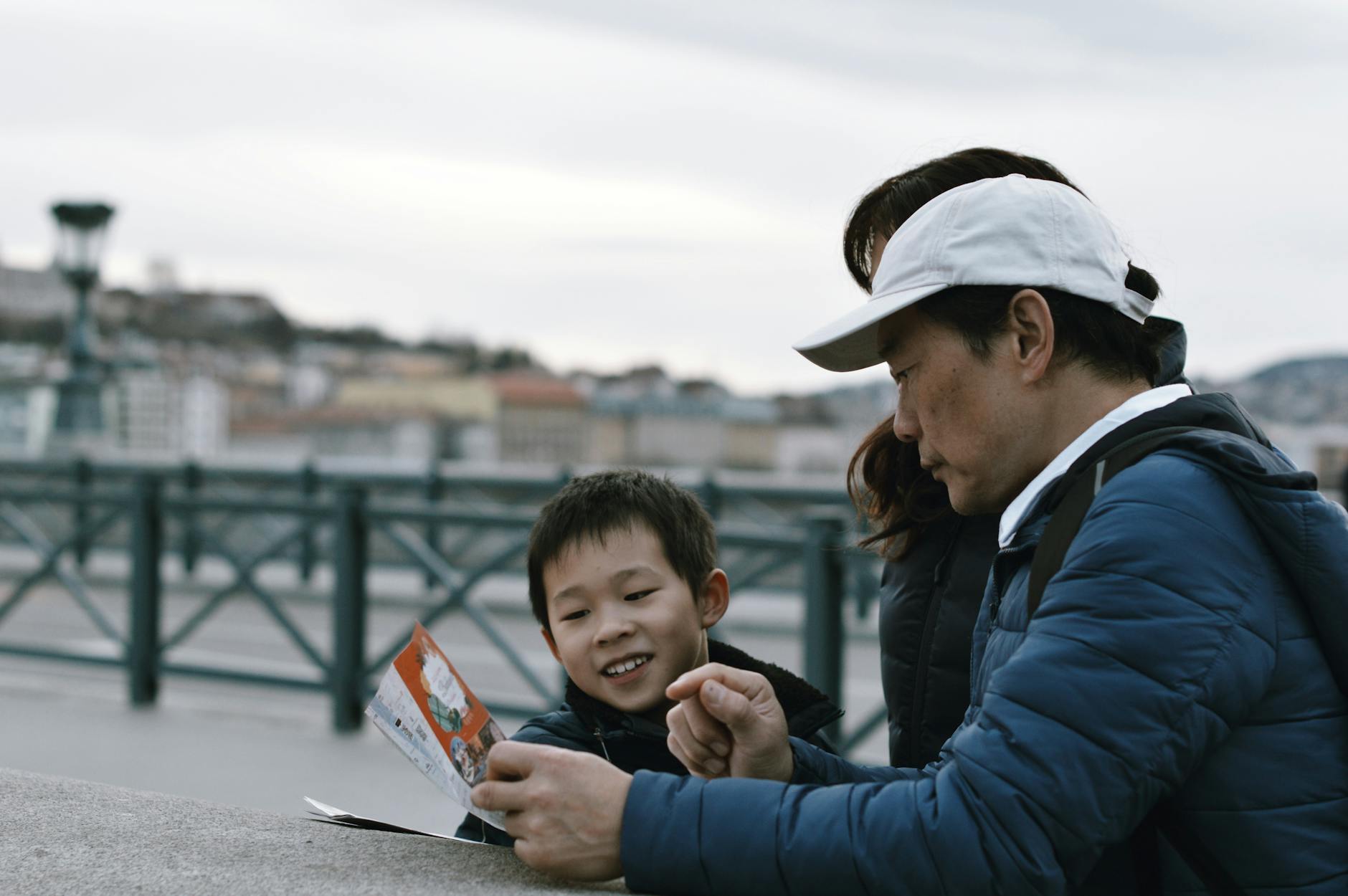 Traveler discussing plans with local guides beside a city sports museum and community center