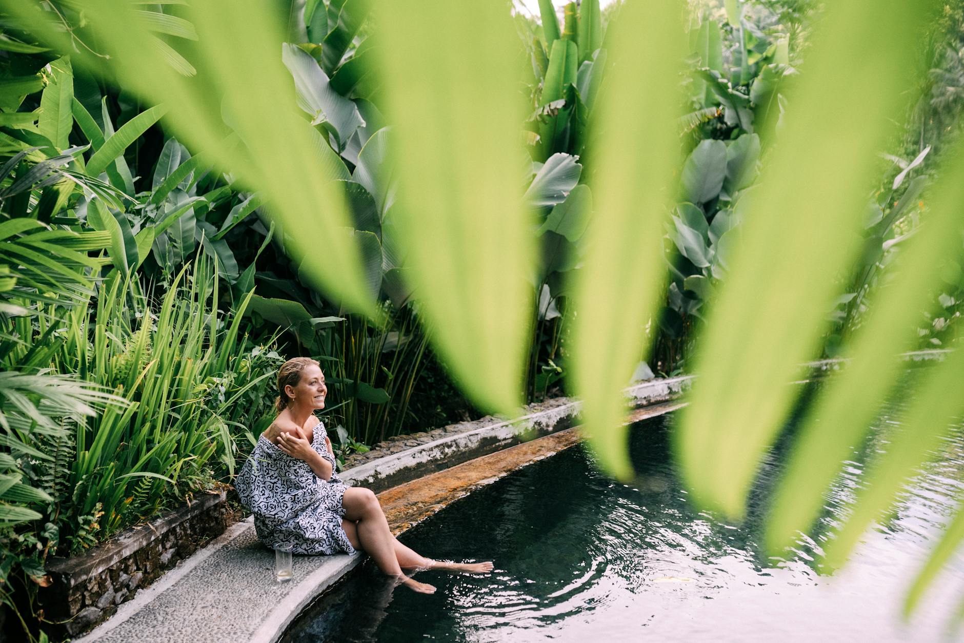 Balinese jungle spa pavilion overlooking rice terraces during golden hour wellness retreat