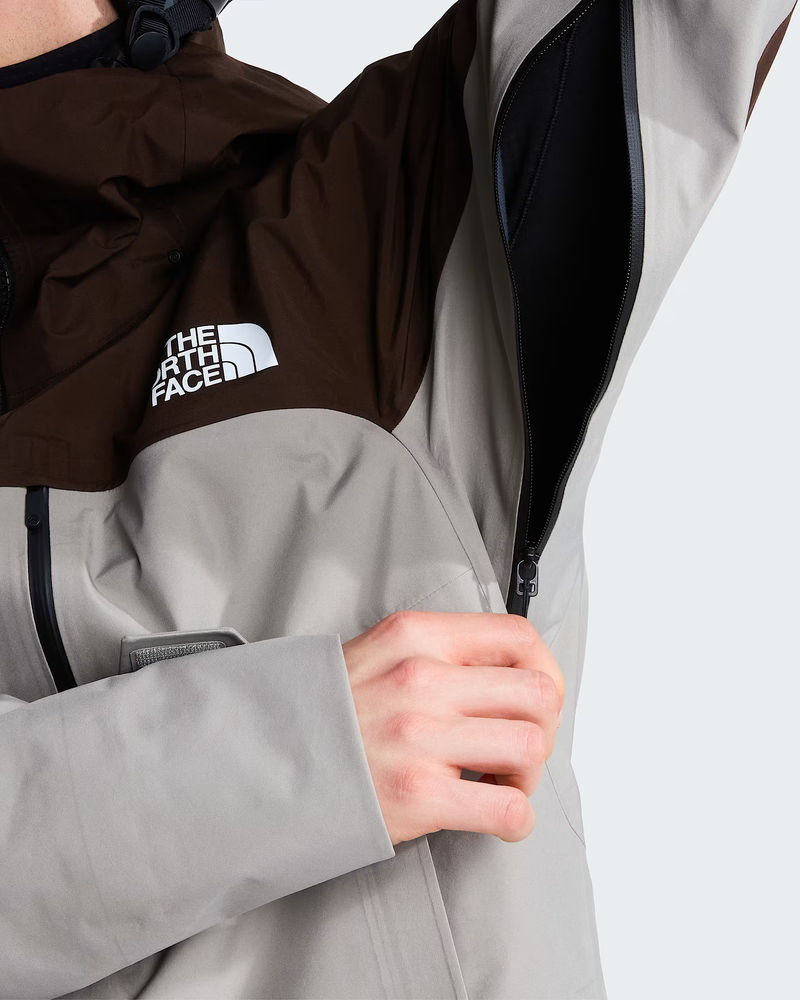 Jacket worn in motion, showing the articulated fit