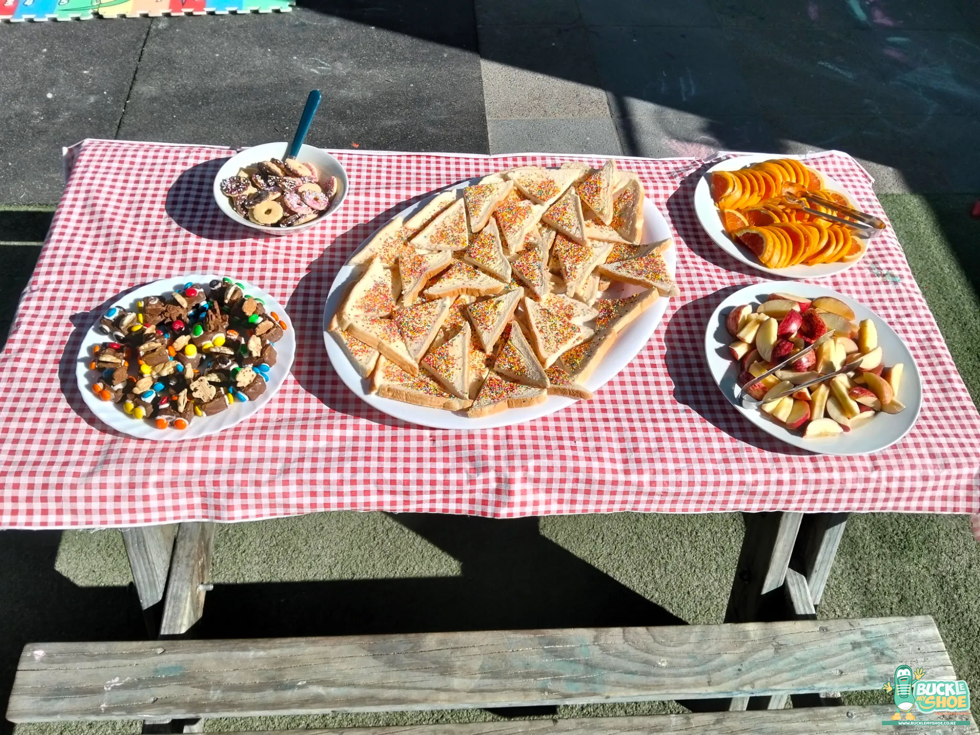 Buckle My Shoe Tauranga & Papamoa | Childcare, Preschool, Daycare | A spread of picnic food including colourful fairy bread slices.