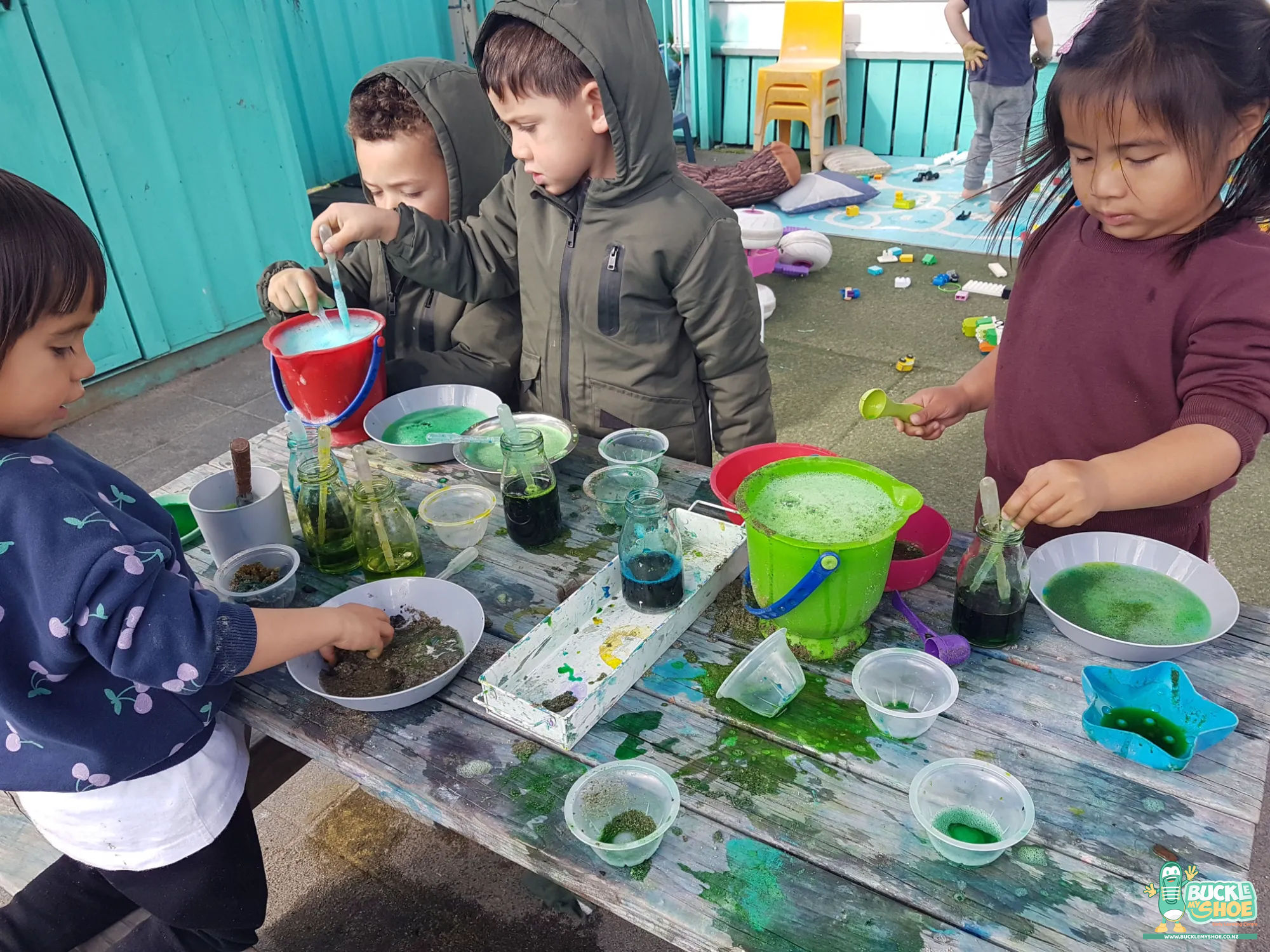 Buckle My Shoe Tauranga & Papamoa | Childcare, Preschool, Daycare | A young child using a dropper to refine their potion with precision.
