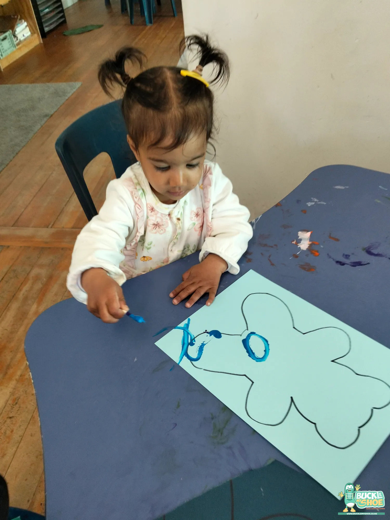 Buckle My Shoe Tauranga & Papamoa | Childcare, Preschool, Daycare | Smiling faces gathered together to celebrate a special day with bears.