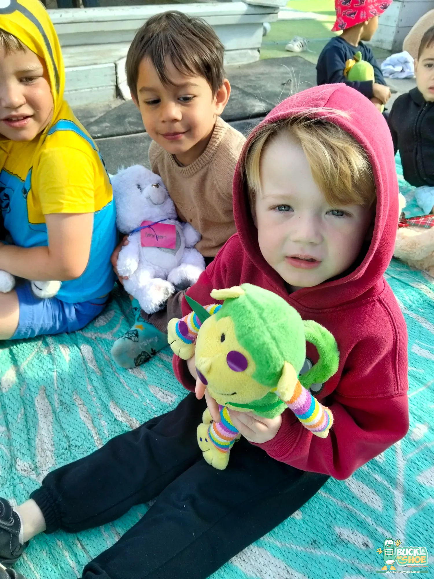 Buckle My Shoe Tauranga & Papamoa | Childcare, Preschool, Daycare | Two friends showing each other their cherished stuffed toys.