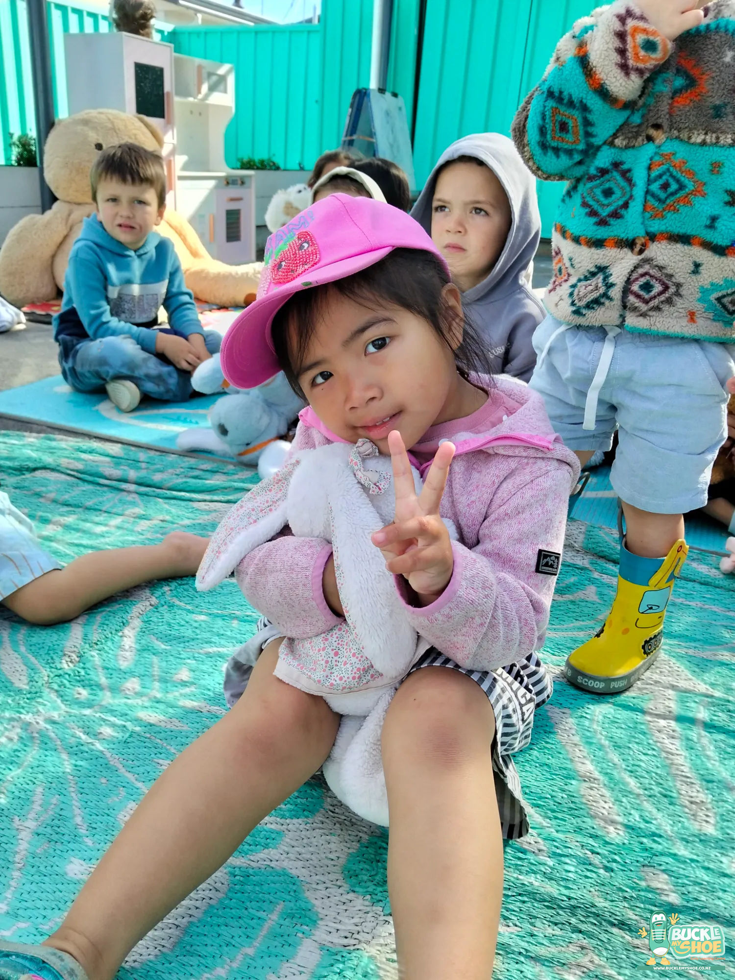 Buckle My Shoe Tauranga & Papamoa | Childcare, Preschool, Daycare | A little girl painting a portrait of her fluffy teddy bear.