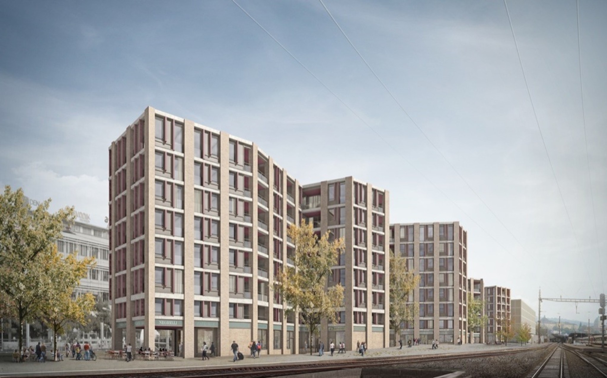 Richtung Geleise falten Esch Sintzel Architekten die Fassade auf, um Licht in die Wohnungen zu holen.