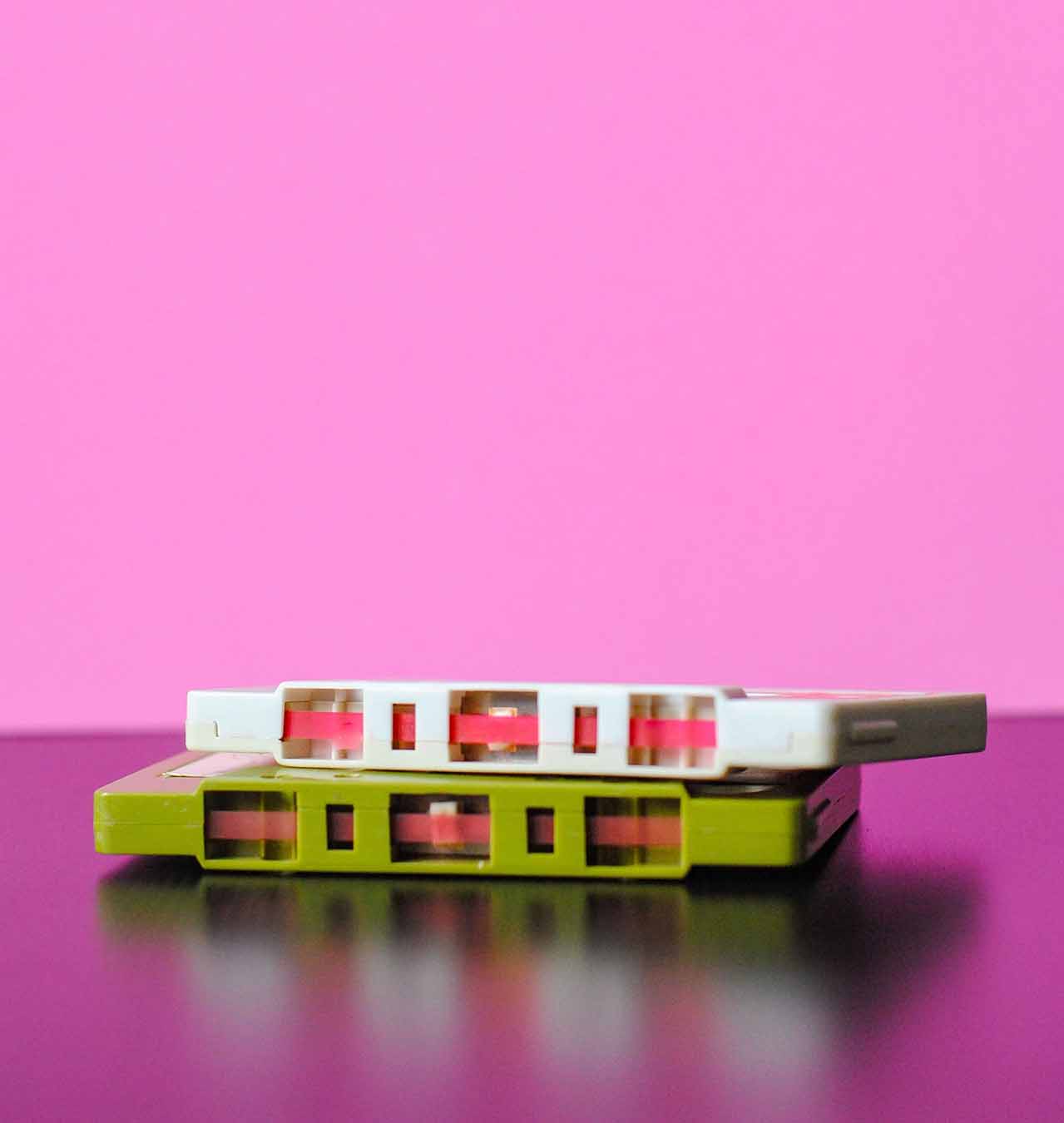 Pink Background with two tape cassettes