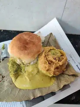 Vada Pav You’ll Regret Not Trying - Best Vada Pav in Mumbai 4 Gajanan Vada Pav style served Vada Pav on a leaf, the Vada and Pav are served separately and both are rolled in their secret Besan and chilies chutney