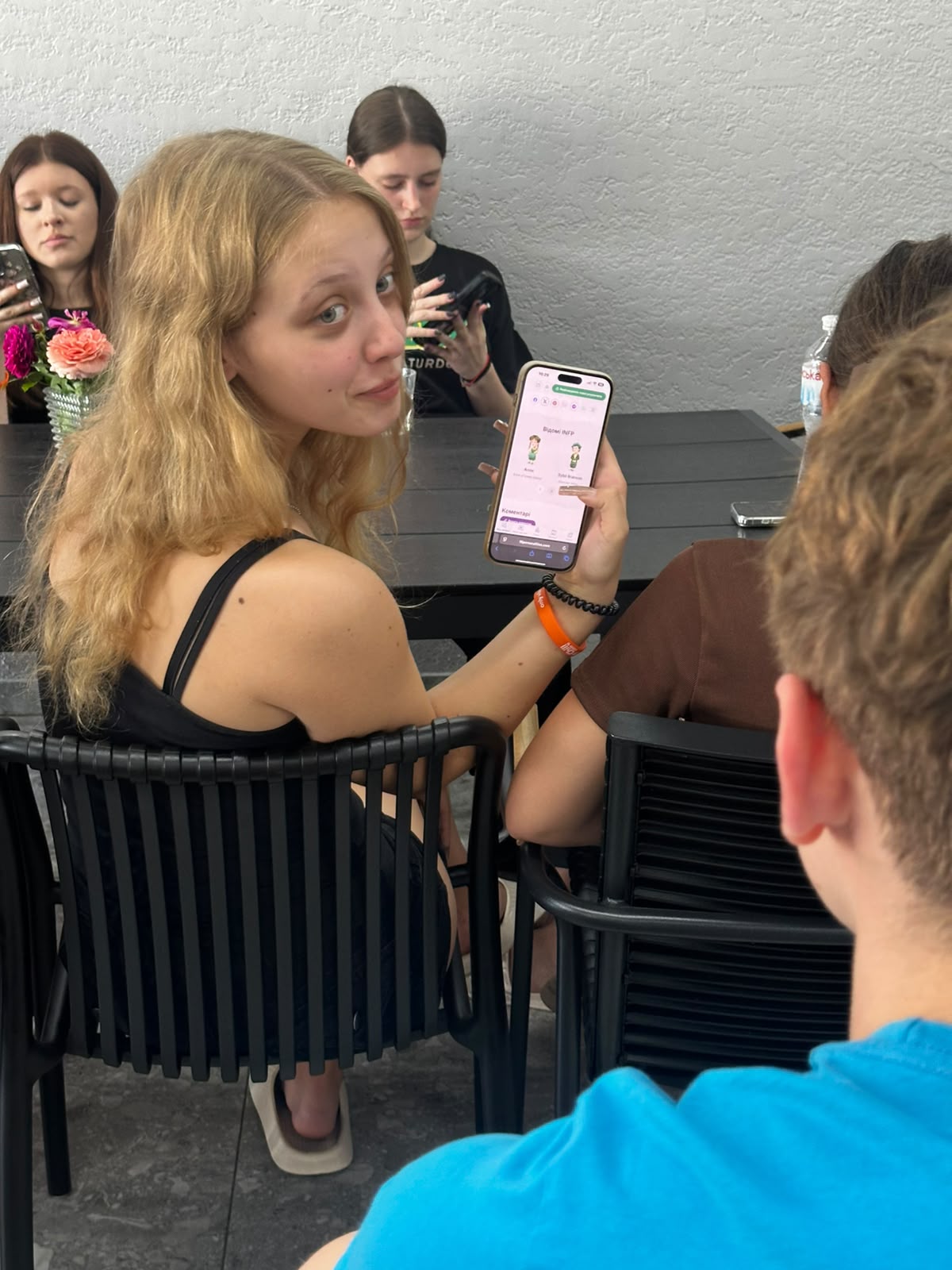 Camp participants spending time together around a table