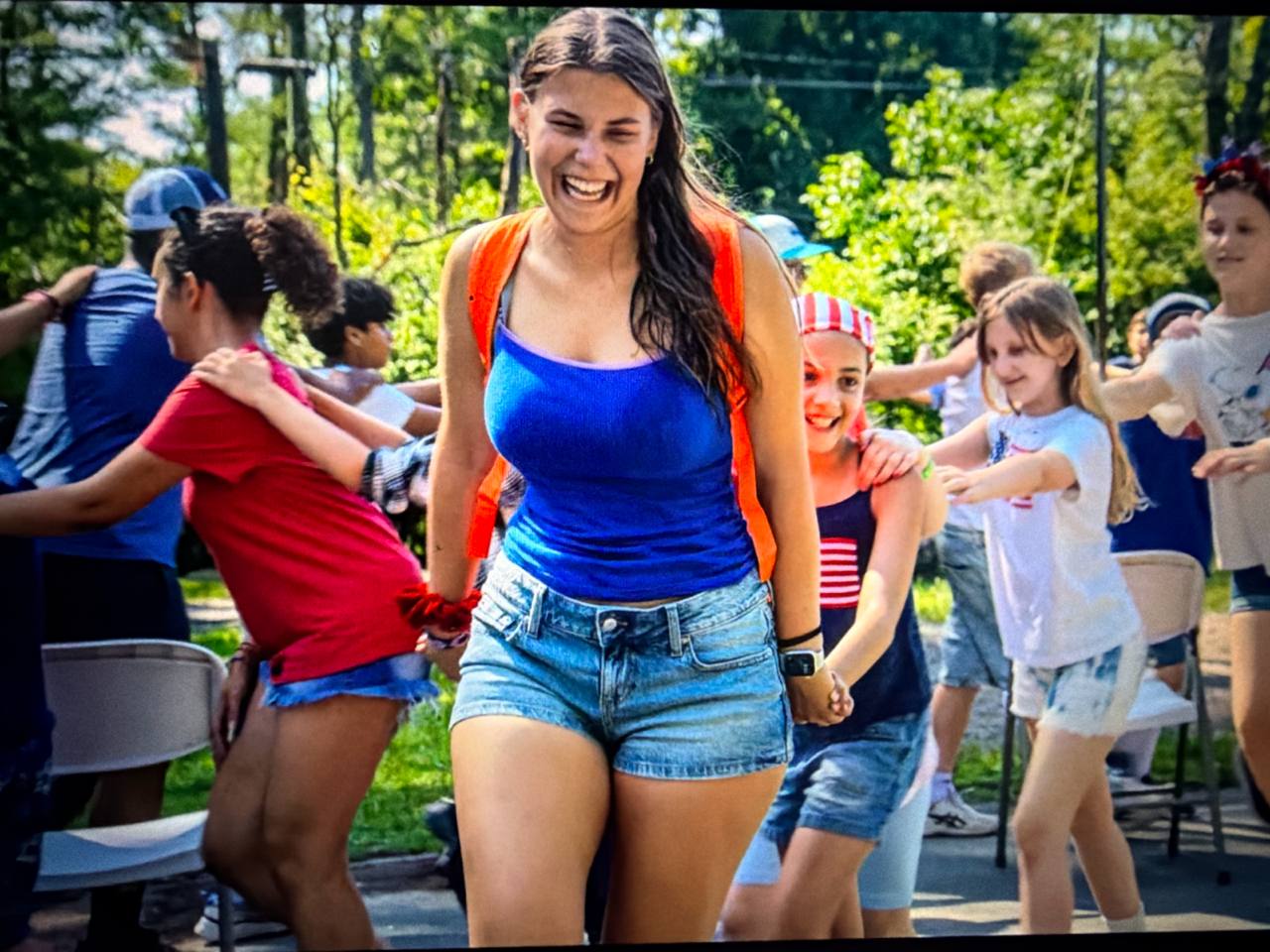 Nikol Rodik taking part in an outdoor group activity with children