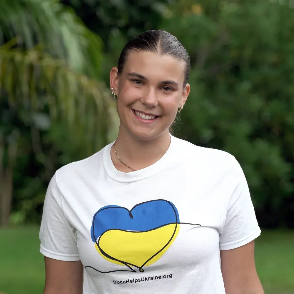 Nikol Rodik wearing a Boca Helps Ukraine volunteer shirt