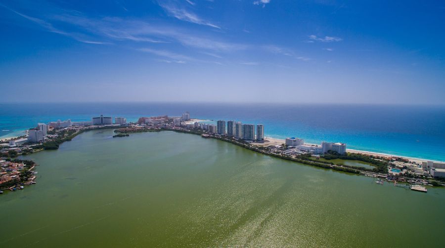 The Hotel Zone from the air: the Nichupte lagoon on one side of Kukulcan Boulevard and the Caribbean on the other.