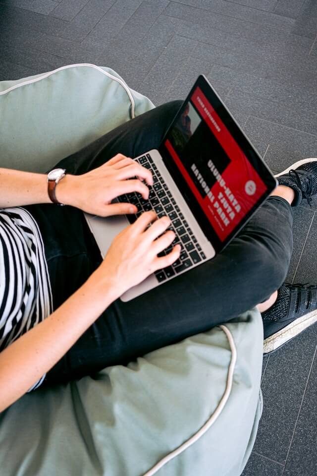 An image of a man while he's designing a website in front of his workstation_AAXGI_Abide AutomationX