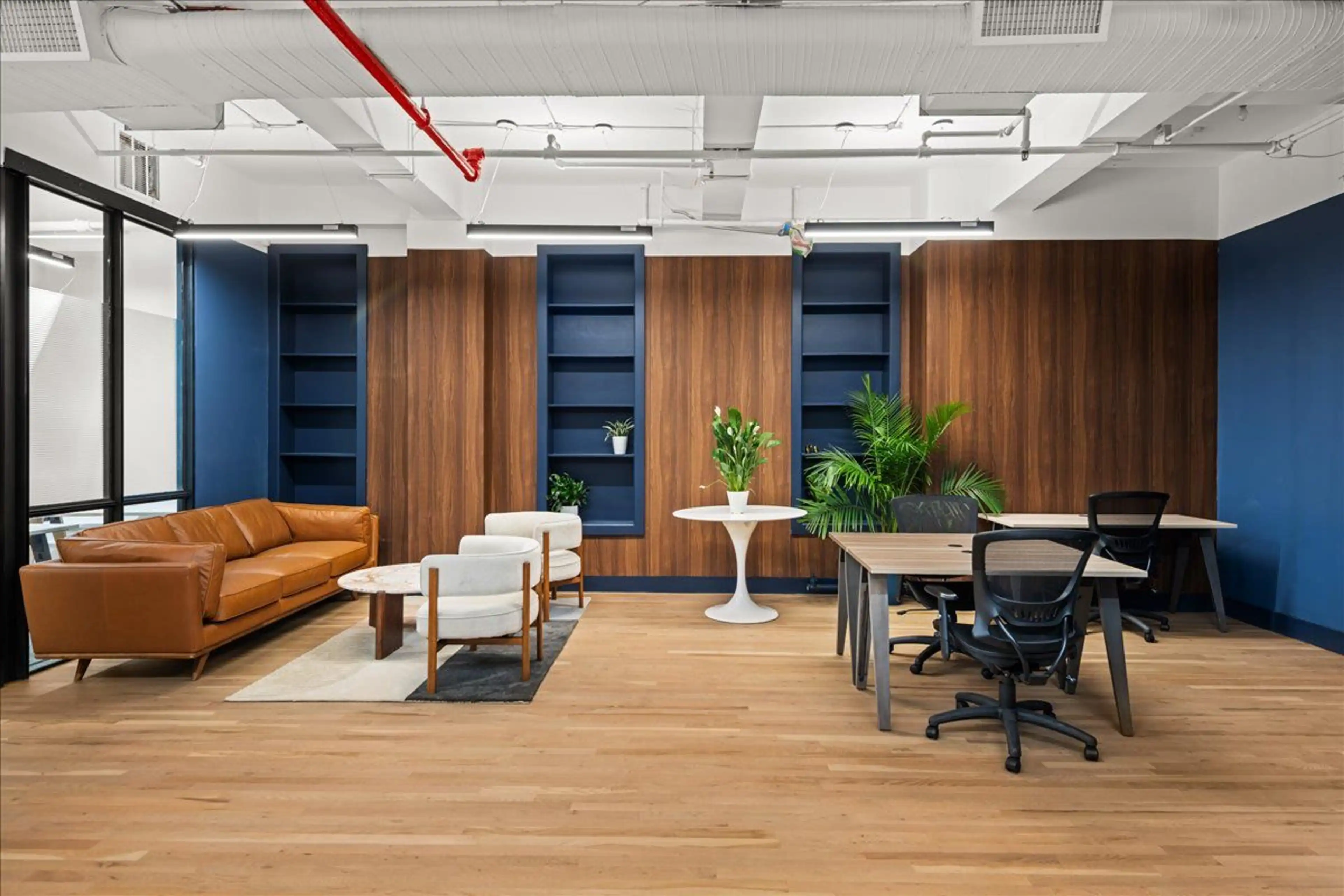 Flatiron District office space blending lounge comfort and coworking functionality.