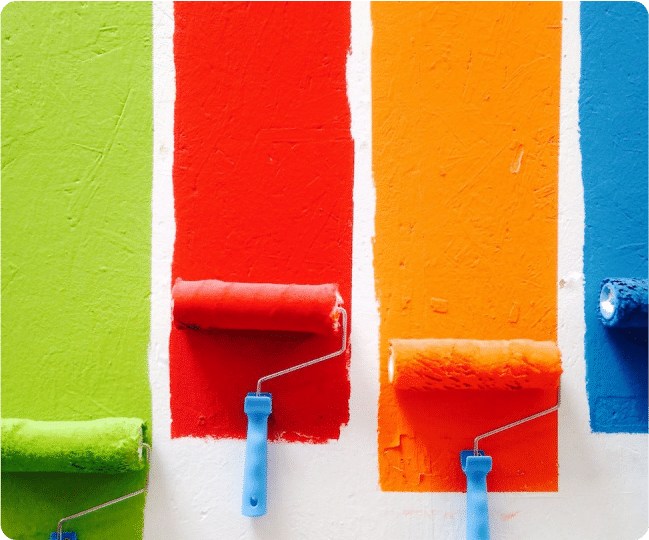 Professional painter painting and repairing a drywall of a house