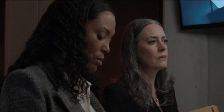 Tara Lewis and Emily Prentiss sitting together in an interrogation room in Criminal Minds: Evolution.