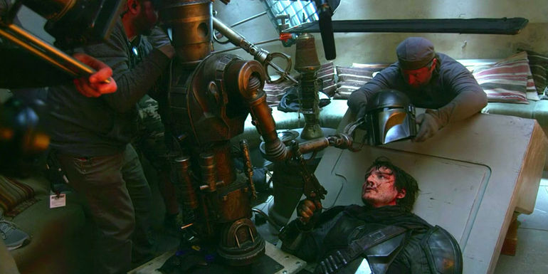 Pedro Pascal as Din Djarin behind the scenes of The Mandalorian season 1 in Disney Gallery: The Mandalorian