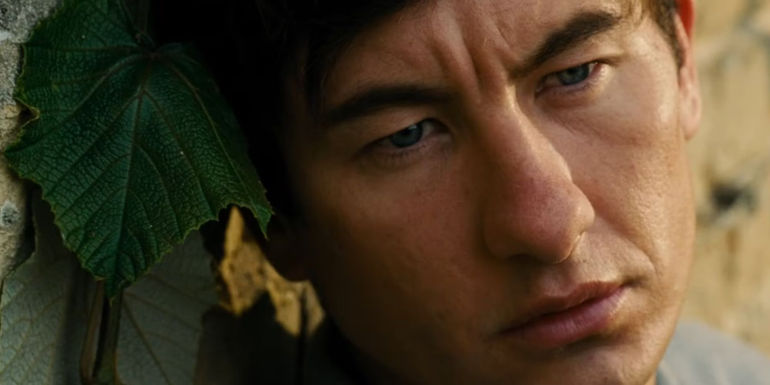Barry Keoghan as Oliver Quick in Saltburn looking lost in thought