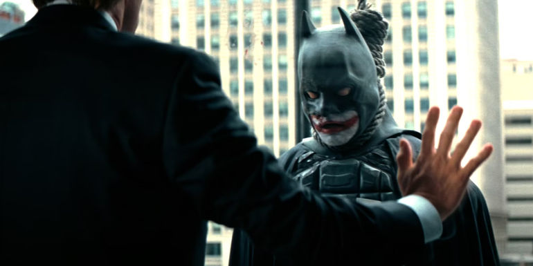 Dead man hanging outside the window in The Dark Knight