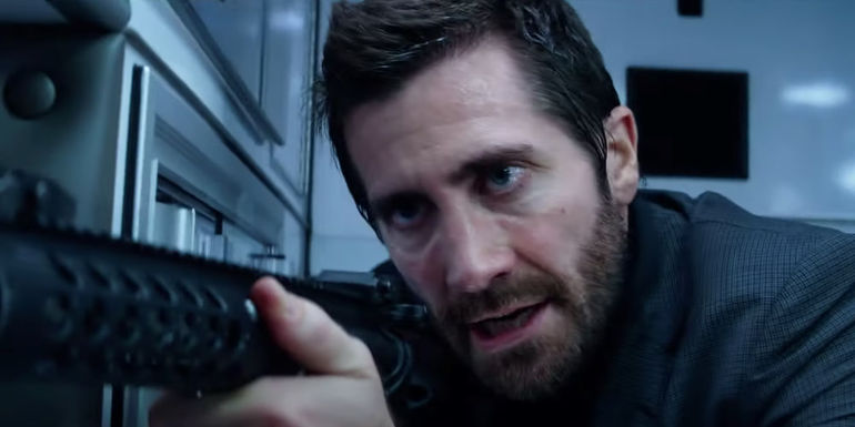Jake Gyllenhaal with a machine gun in Ambulance
