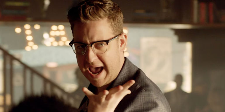 Josh Hoberman sings during the musical episode of The Magicians season 3.