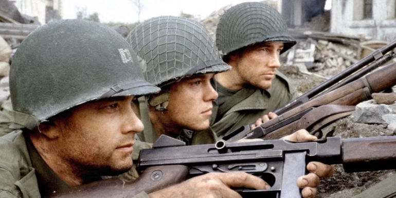 Tom Hanks, Matt Damon, and Ed Burns as Miller, Ryan, and Reiben hunkered down with rifles in Saving Private Ryan