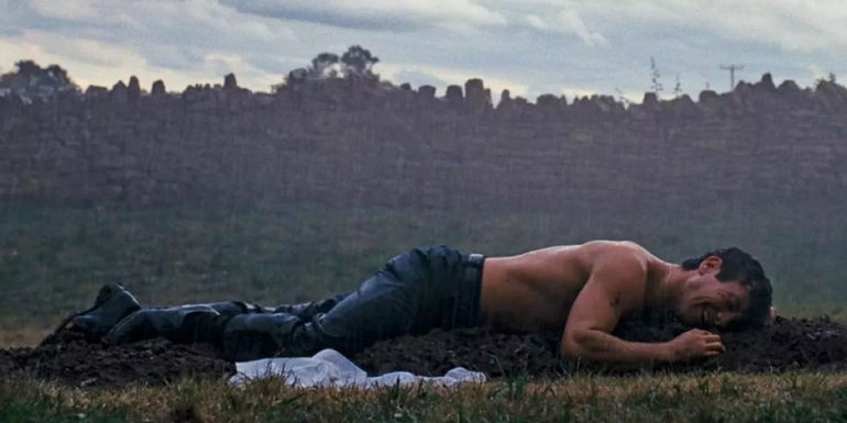 Oliver crying at Felix's grave in Saltburn