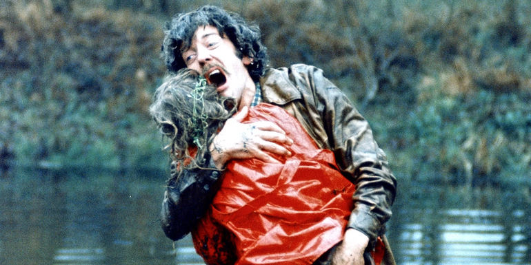 John cradles his daughter in Don't Look Now