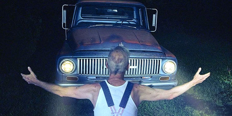 A man stands in front of a truck in Uncle Otto's Truck, a short film
