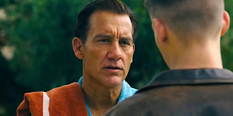 Clive Owen engaged in serious conversation in a dramatic scene from Monsieur Spade