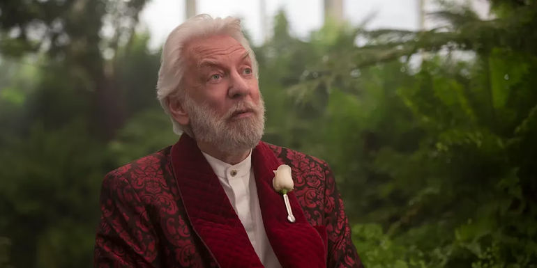 President Snow wears a rose in The Hunger Games.