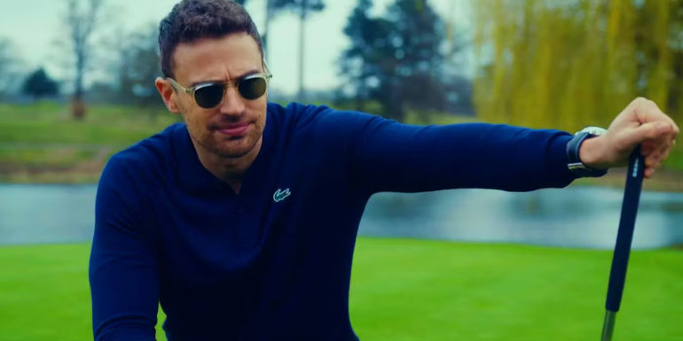 Theo James as Eddie Halstead playing golf in The Gentlemen trailer 