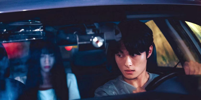 Yoon Chan-young as Seo Young-min driving a car with a ghost in the backseat in Delivery Man