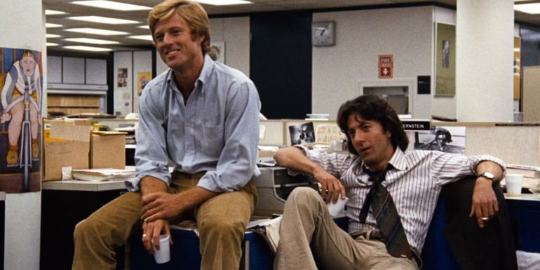 Bob and Carl sitting down and looking in the same direction in All-the-President's-Men