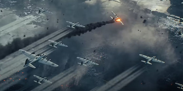 An aerial battle with a plane on fired going down in Master of the Air