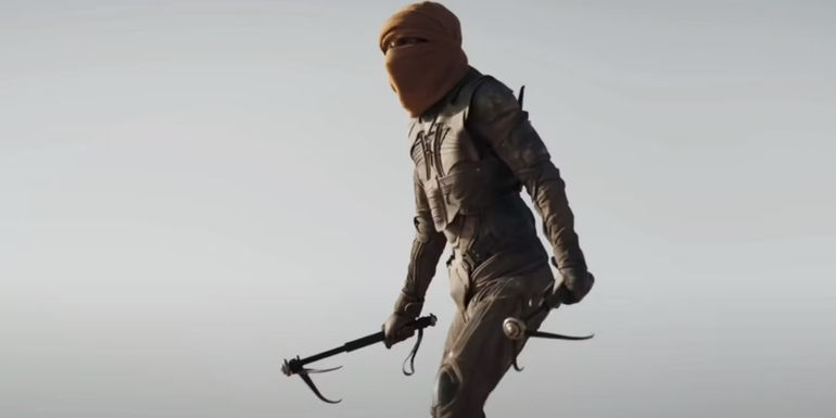 Paul (Timothée Chalamet) holds sandworm spikes in Dune 2's trailer.